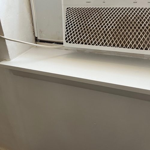 Window sill after repair and painting by The Island Handyman