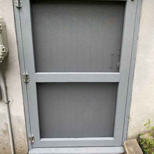 Screen door after rebuilding by The Island Handyman
