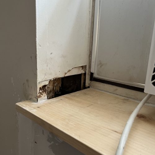 Rot-damaged window sill before repair by The Island Handyman